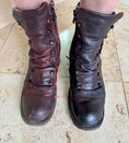 Load image into Gallery viewer, A pair of dark red leather boots, the faded boot on the left has not been treated with Leather better. The right boot has been treated with Leather better.
