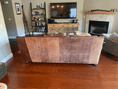 Load image into Gallery viewer, Gif shows different stages of a back of a tan leather couch being treated showing the results.
