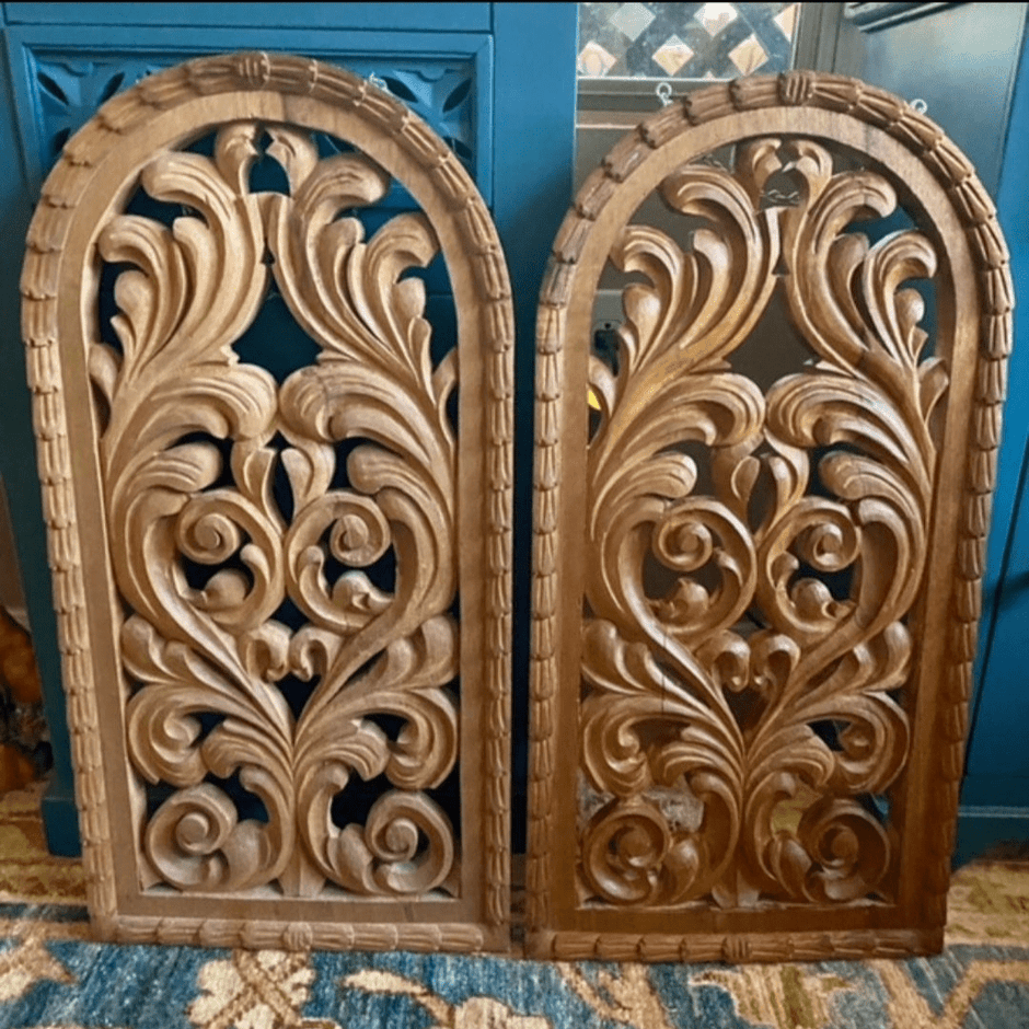 Two decorative wood panels with intricate flourishes carved in. Panel on the left hand side is before being treated with Leather better. The right panel shows the wood after being treated with Leather better.