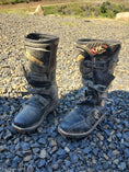 Load image into Gallery viewer, a pair of scuffed motor cross boots prior to being treated with Leather Better.