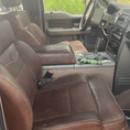 Load image into Gallery viewer, King Ranch car seats after being treated with Leather Better. Customer, Joanne's five star review: "Used this on my truck seats. It did darken the seats but it did take quite a bit of product so get the big container.
Overall happy with the product and would buy again."