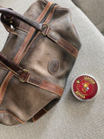 Load image into Gallery viewer, A faded leather weekender bag prior to being treated with Leather Better; the fading makes it look dirty.