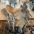 Load image into Gallery viewer, An old roping saddle prior to being treated with Leather Better. Very faded, cracked, and dry showing its age.