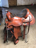 Load image into Gallery viewer, A red and brown western style saddle that has been treated with Leather Better. Wayne's five star review: "Works Great!! Bought this to condition a couple of older saddles I bought.  I wish I had taken before and after pictures.  The difference is amazing.   I then used it on a jacket and boots. This is a quality product and highly recommend.  Other people have been asking me what I used. I’ll be a repeat customer."