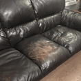 Load image into Gallery viewer, A black leather couch prior to being treated with leather Better. Scratches on the couch seats, especially the middle one that has lost its colour.