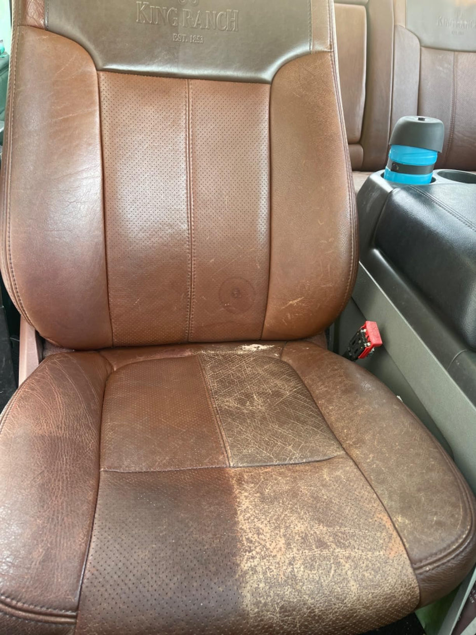 A Ford King Ranch passenger seat with half of the seat treated with Leather better, while the other side is scratch and faded to show the before and after.
