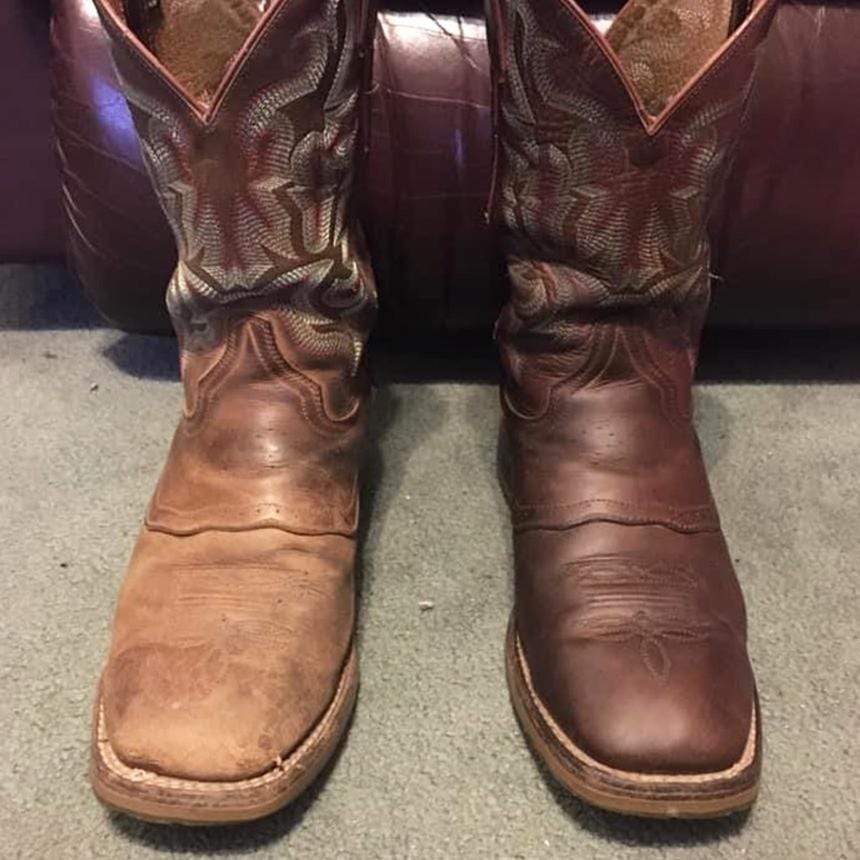 A pair of brown leather cowboy boots.  The left has been restores with Leather Better and is looking moisturized and is a deep brown again.  The right boot is dry and faded.