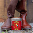 Load image into Gallery viewer, A pair of tall deep red leather boots.  The left has been restored with Leather Better and looks new while the right boot is dusty and faded to closer to brown in colour.  A tub of Leather Better is nestled between the pair.
