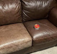 Load image into Gallery viewer, A dark brown leather couch with a can of Leather better on the right side couch  cushion.The left side of the couch has not been treated and is scratched and worn. Right side of the couch has been treated with Leather better.