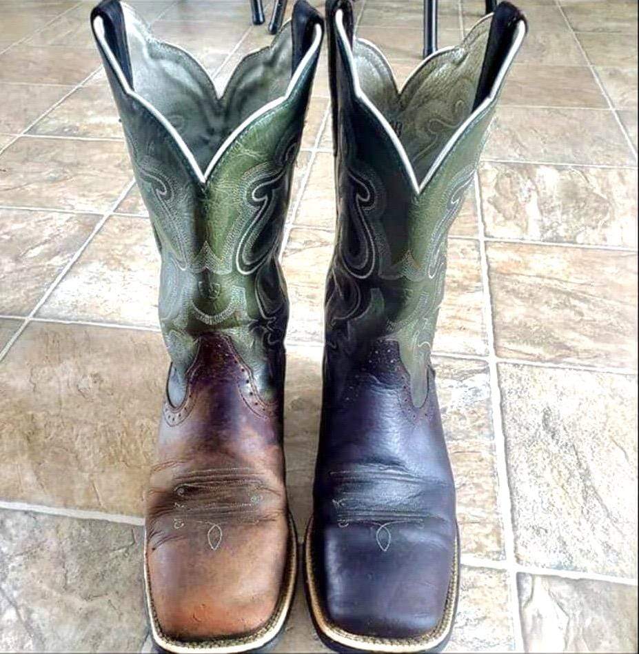 A pair of cowboy boots where the left has been treated and the colour restored whereas the right looks like it isn't even the match for the pair.