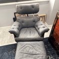 Load image into Gallery viewer, A faded grey armchair and ottoman prior to being treated with Leather Better.
