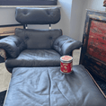 Load image into Gallery viewer, A restores grey armchair and ottoman after being treated with Leather Better.
