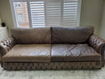 Load image into Gallery viewer, Split view: the couch's left side is fully restored vs the right side is untreated. The large chesterfield style couch showing dramatic improvement in texture and colour. Customer, Liljanna
s five star review: "Our couches are 10 years old and this made them look like new again! I will definitely order more and have already recommended this to friends and family!"

