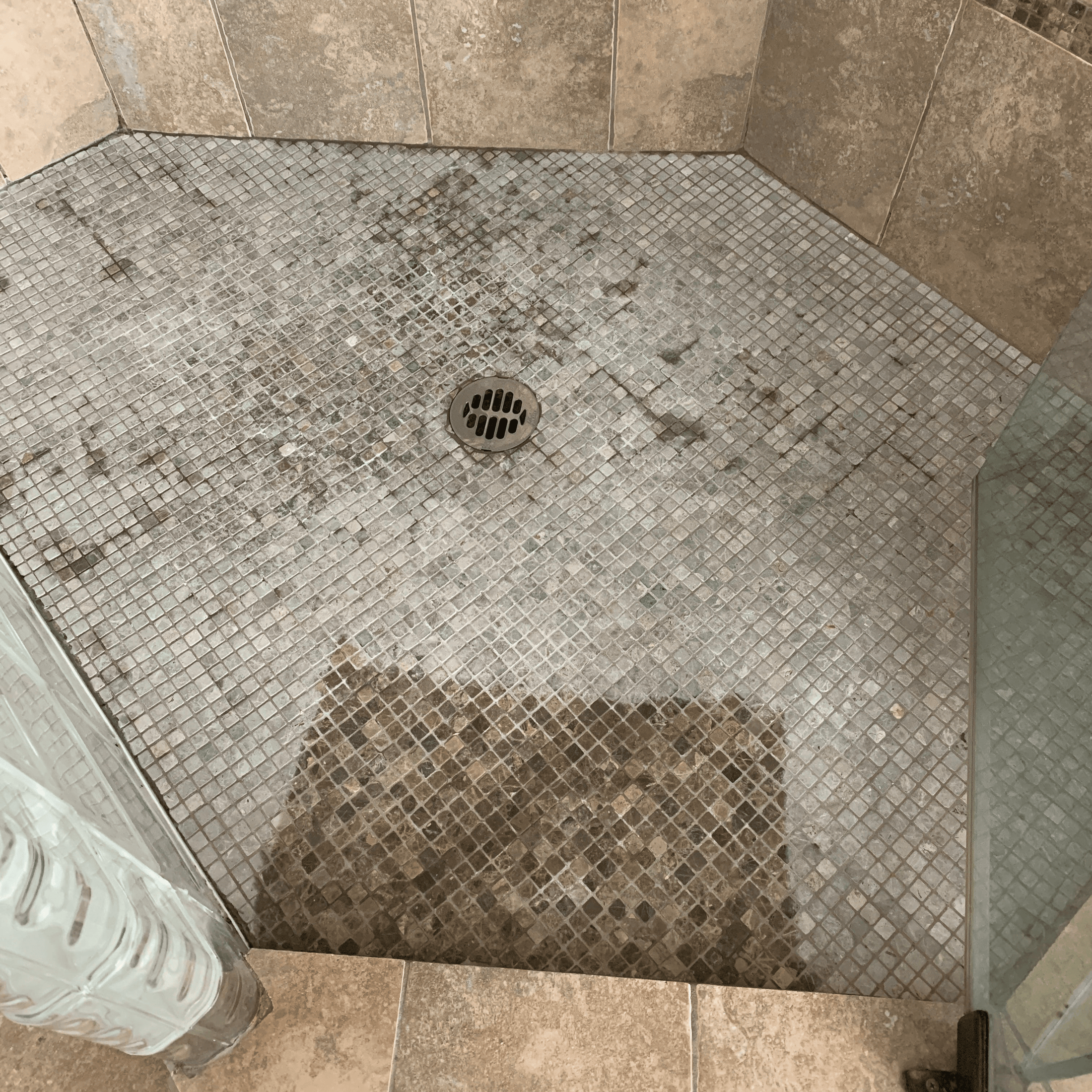 Before and after of a shower floor, the lower section cleaned and restored, compared to the untreated upper area. Shelley's five star review: "I borrowed a can of Leather Better from a friend to revitalize the knotty alder cabinets in my kitchen.  On a whim, I decided to use it on my granite mosaic tiled shower as it had lost its depth of colour over the years of use.  Surprise! My shower looks like the day it was built and with no slippery finish!  So glad I took a chance and used it unconventionally!"