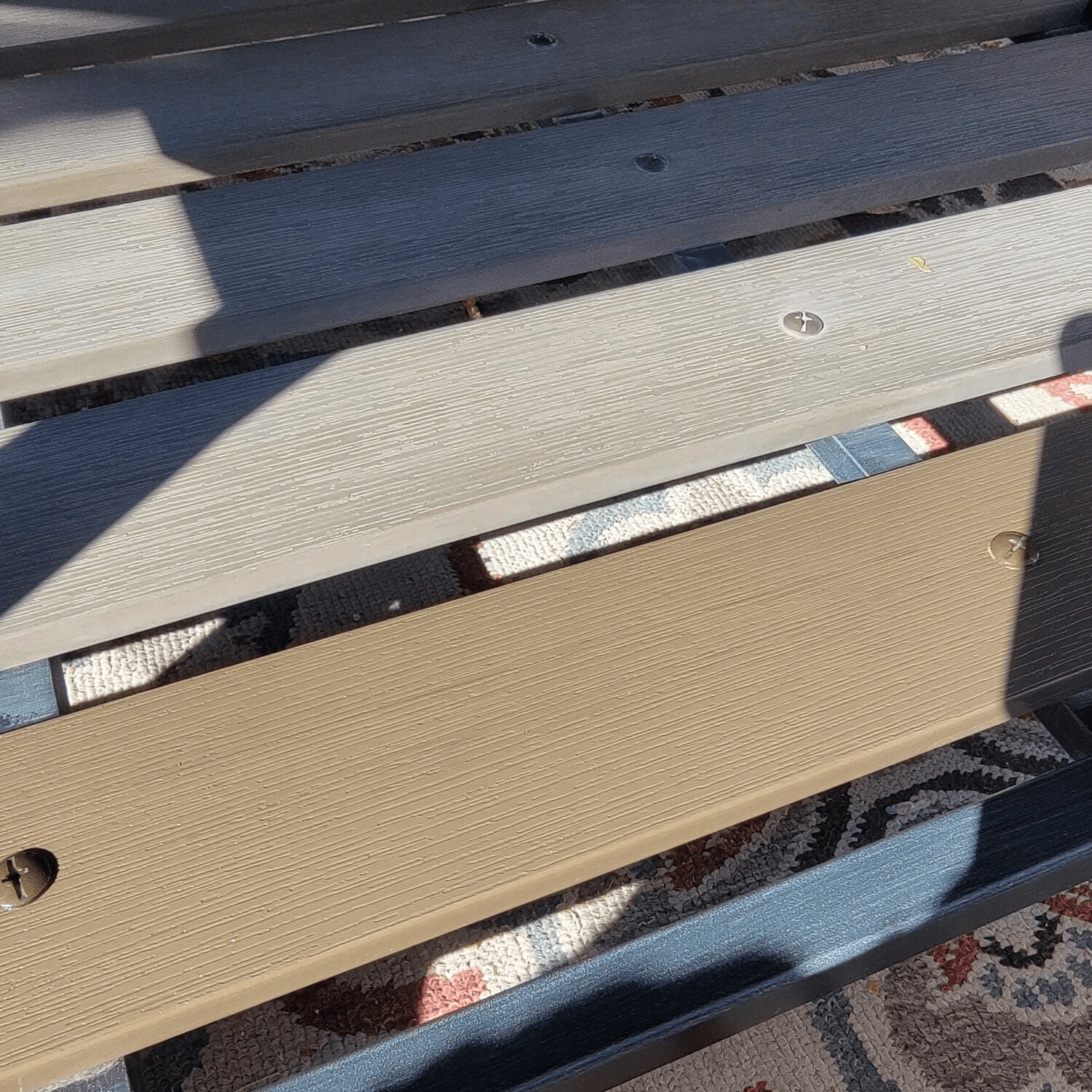 A close up image of patio furniture showcasing before and after treatment.  The top have of the image is faded and dull grey looking colour.  The section that has been treated is more brown and looks new.  Kari's five star review: "I bought it to use in my leather couch and it worked great. Then I used it on my wood composite and metal patio furniture and made it look like new (it was old and very weathered looking before). No chemicals and pretty much a miracle worker around the house. Highly recommend!"