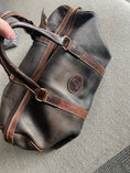 Load image into Gallery viewer, A restored weekender bag after treatment with Leather Better.  Customer, John's five star review: "Leather Better just made my go-to leather weekender bag SO worth traveling with again!  Thank you!"
